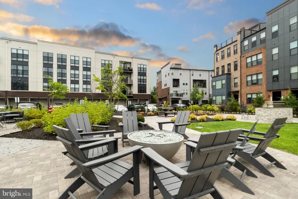 a view of a patio with couches table and chairs