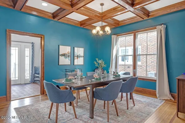 a view of a dining room with furniture and window