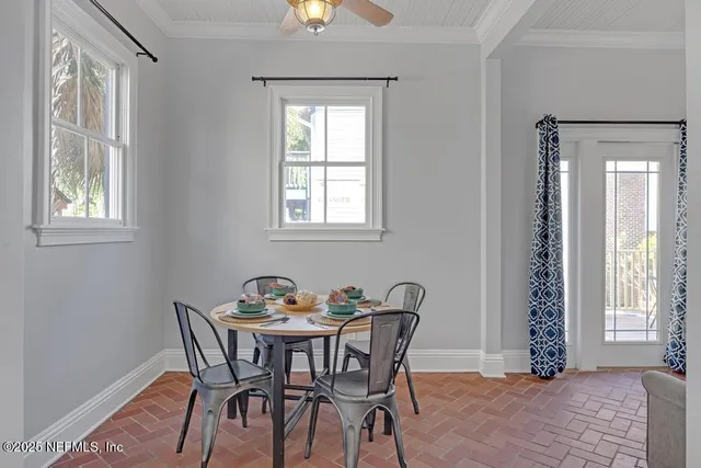 a bathroom with a granite countertop sink a mirror and a toilet