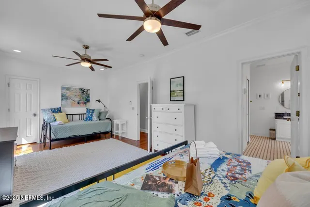 a bedroom with a large bed and window