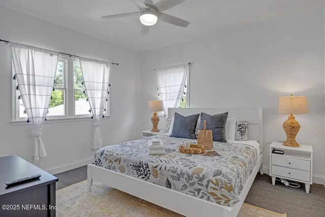 a view of a house with backyard and deck