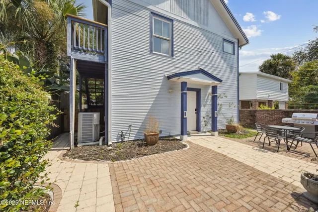 a view of a workspace with furniture and wooden floor