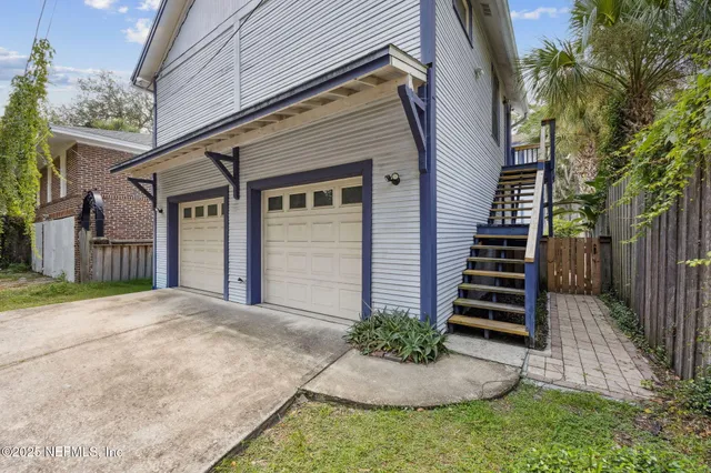 a bedroom with a bed and a table in it