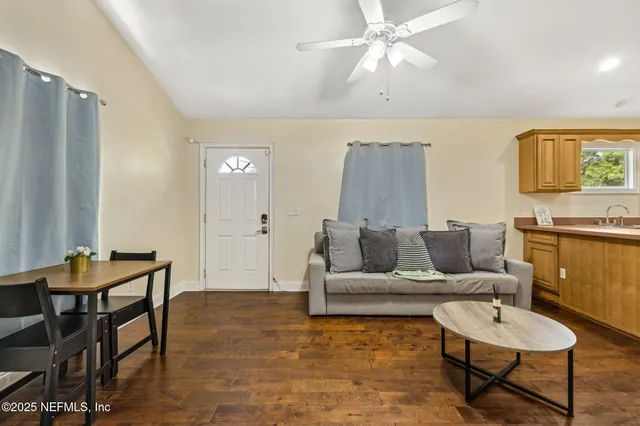 a bathroom with a sink toilet a mirror and shower