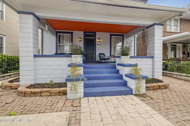 a living room with furniture window and wooden floor