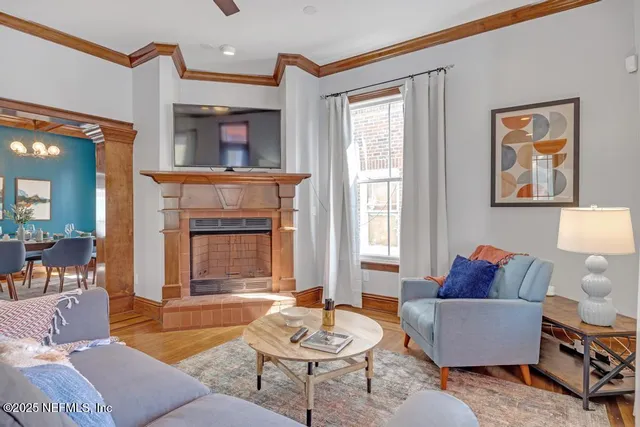 a kitchen with granite countertop wooden cabinets and a stove