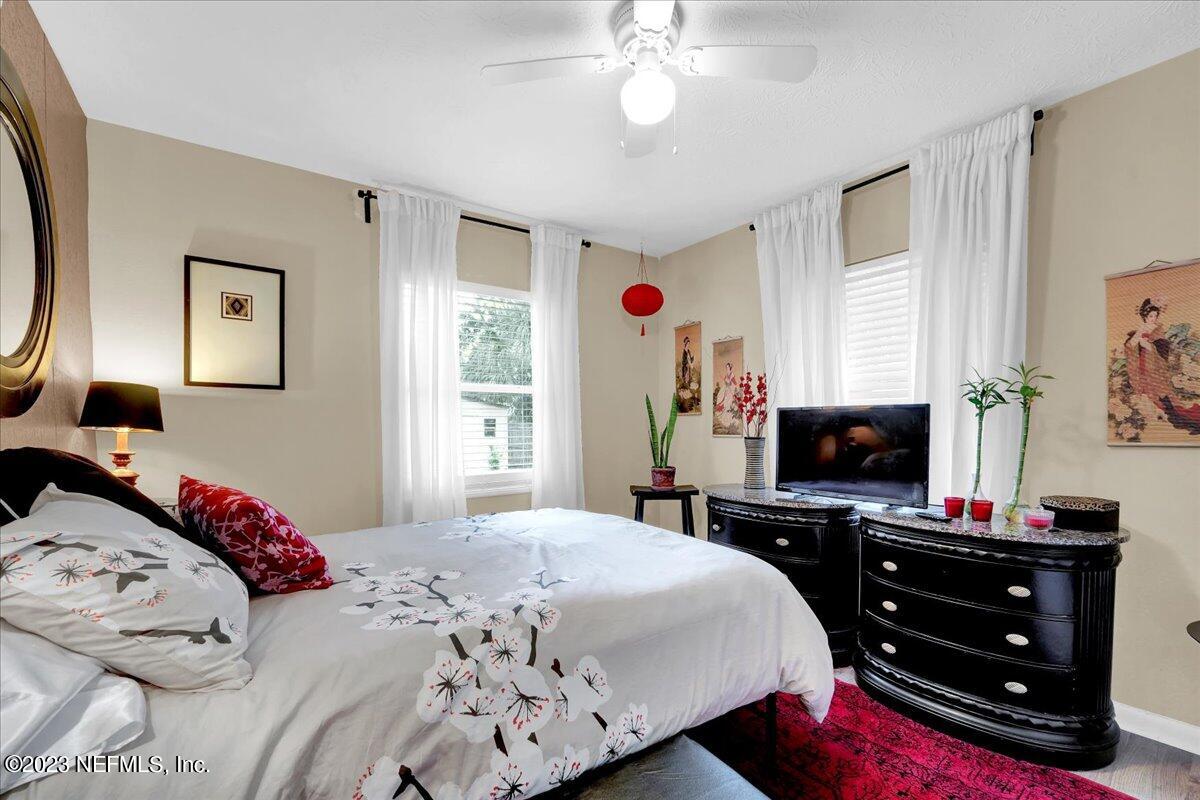 1975 Talladega Road Jacksonville, FL 32209 - Photo 11 of 15 a bedroom with a bed and a flat tv screen on the dresser