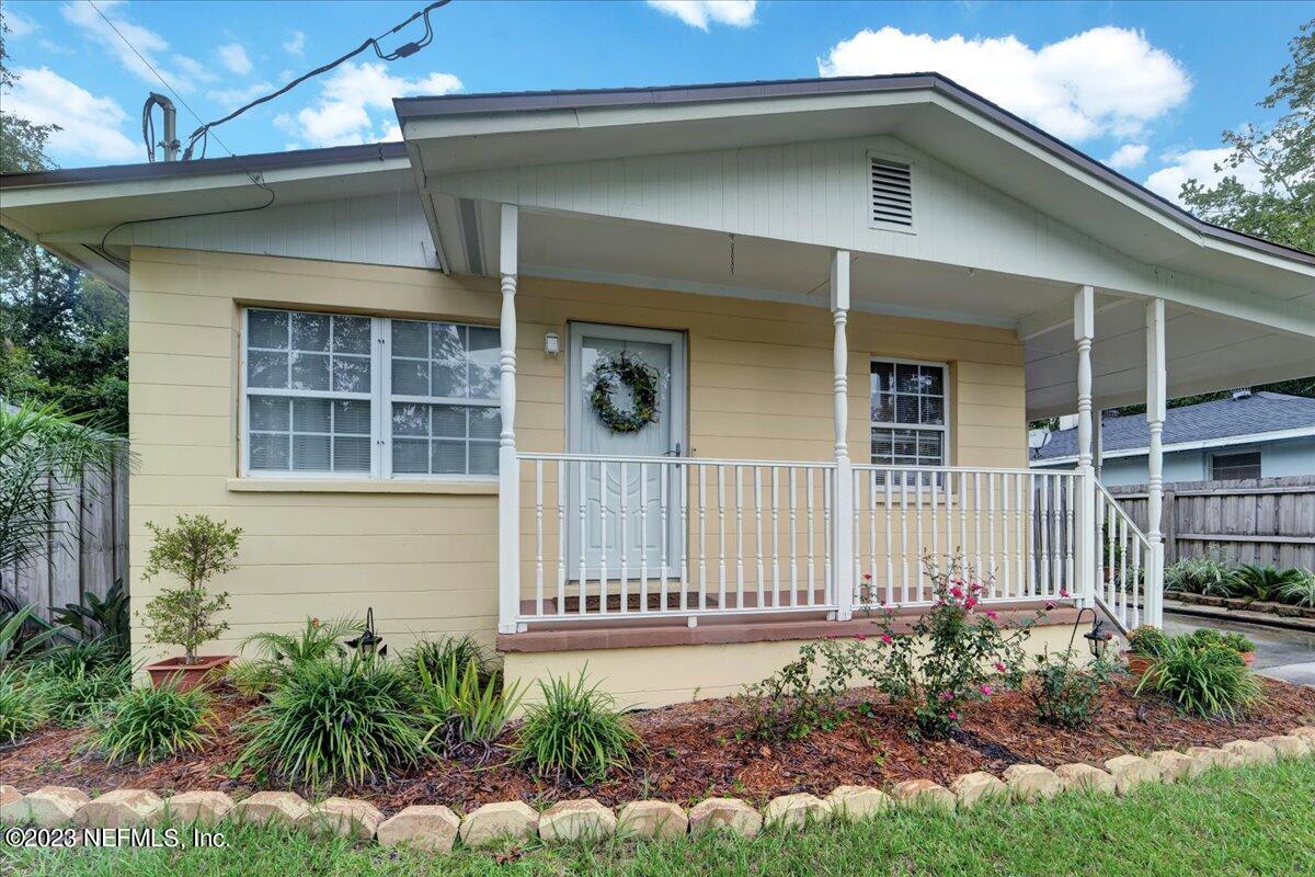 1975 Talladega Road Jacksonville, FL 32209 - Photo 2 of 15 a front view of a house with a garden