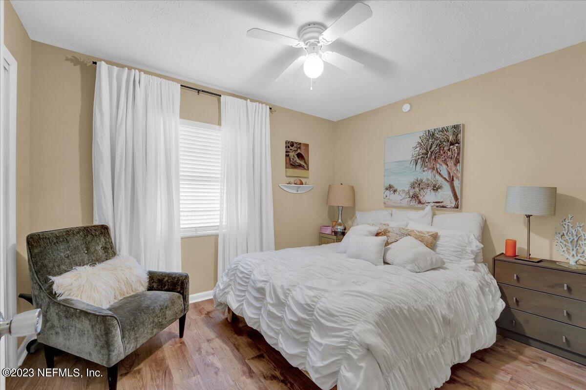 1975 Talladega Road Jacksonville, FL 32209 - Photo 8 of 15 a bedroom with a bed and a couch