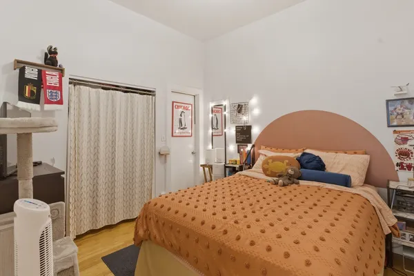 a bedroom with a large bed and a couch