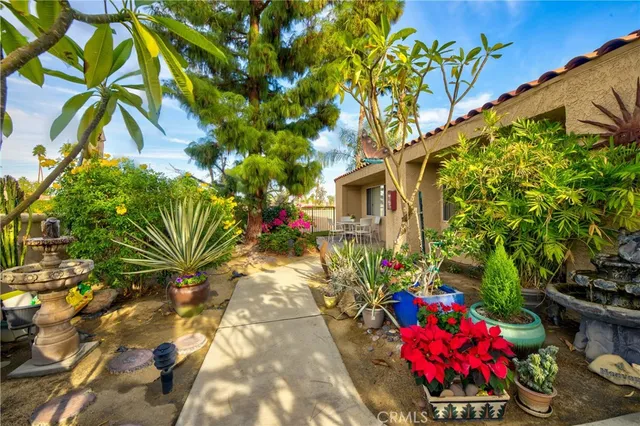 a dining room with furniture and flowers