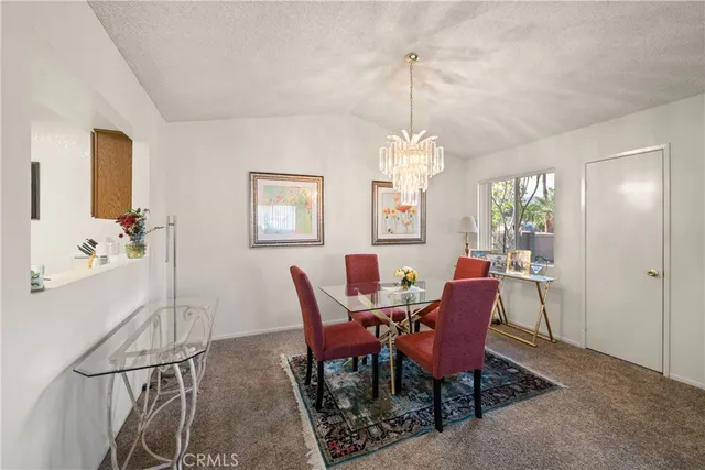 a living room with furniture a rug and a window