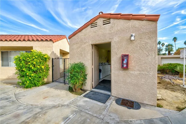 a large white kitchen with a stove a sink dishwasher and a refrigerator