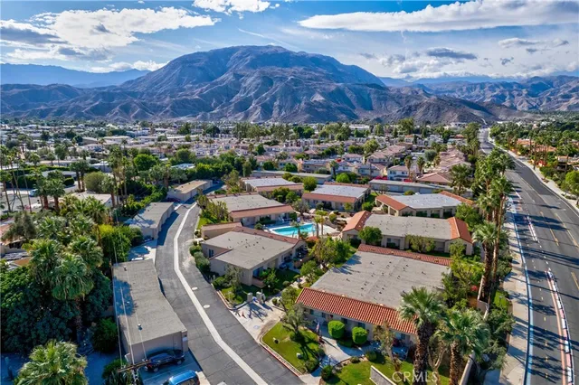 an aerial view of residential houses and outdoor space
