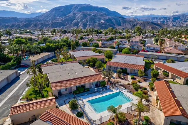 an aerial view of a house with a garden