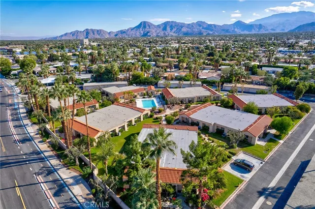 an aerial view of residential houses and outdoor space