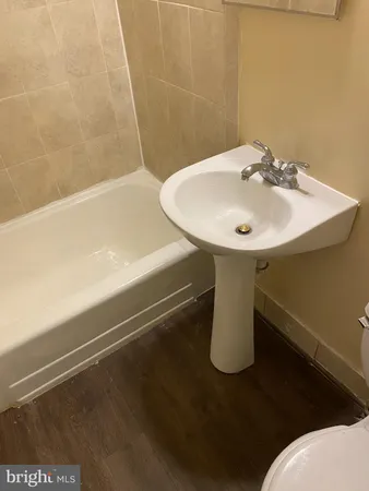 a bathroom with a sink and mirror