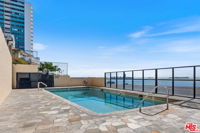 a view of a swimming pool with a lounge chairs