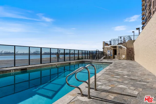 a view of swimming pool with outdoor seating