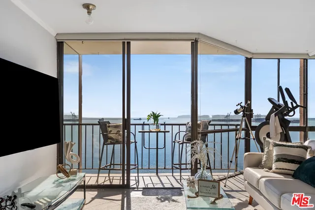 a view of living room kitchen and windows