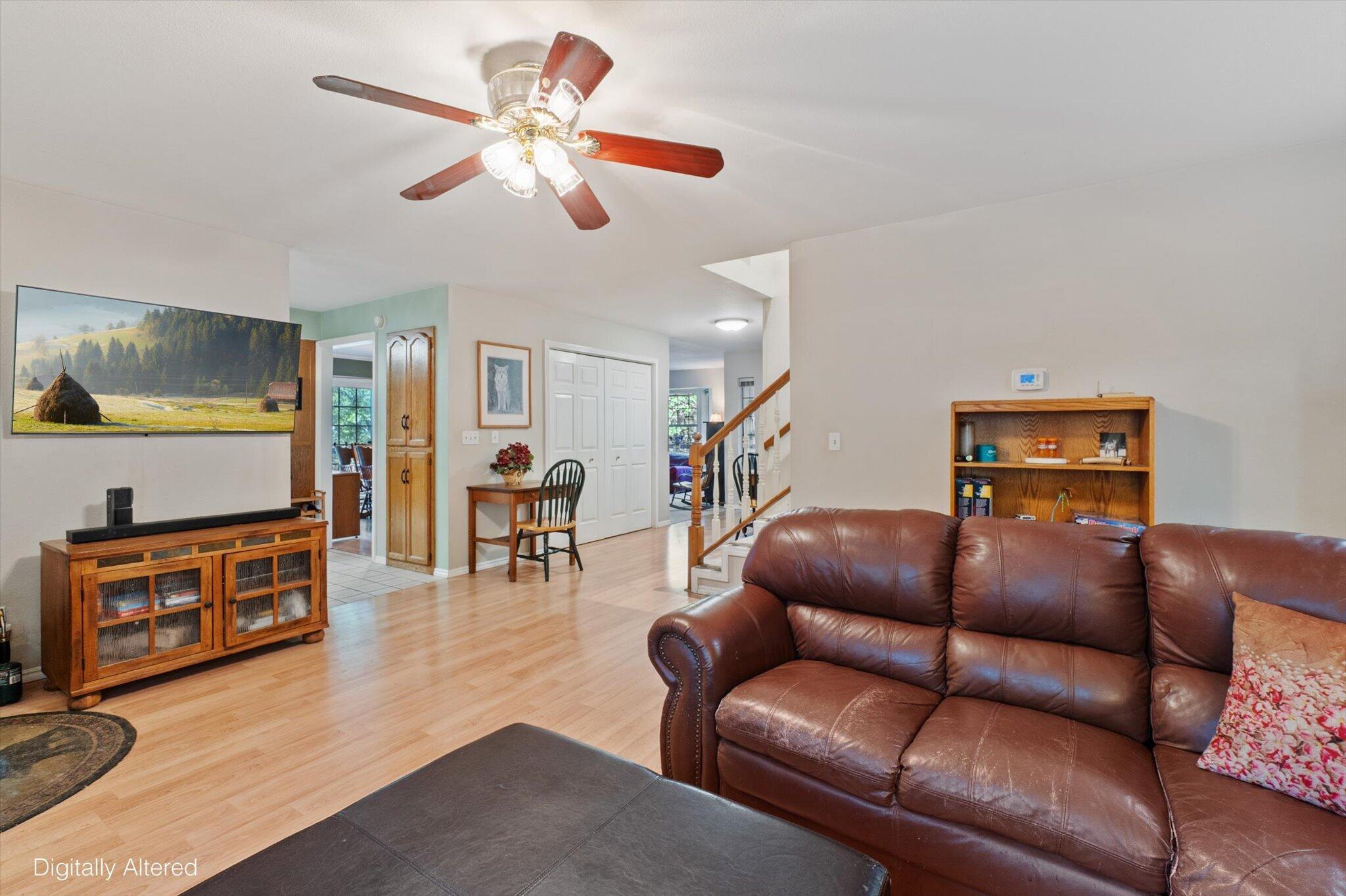 26997 Lookout Mountain Road Oak Run, CA 96069 - Photo 10 of 92 a living room with furniture a ceiling fan and a wooden floor