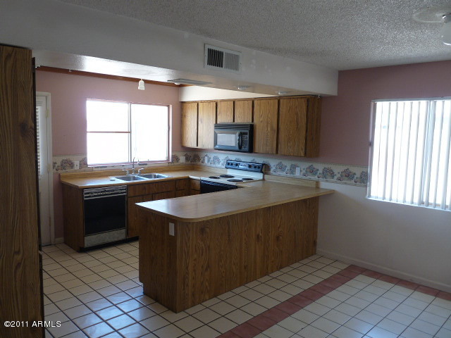 7313 West Hatcher Road Peoria, AZ 85345 - Photo 5 of 13 KITCHEN 1