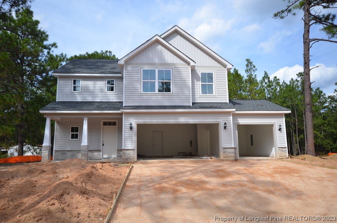 822 Quewhiffle Road Aberdeen, NC 28315 - Photo 1 of 7 a front view of a house with a yard and garage