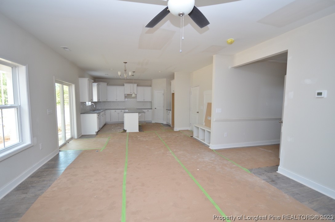 822 Quewhiffle Road Aberdeen, NC 28315 - Photo 3 of 7 a large white kitchen with a refrigerator and microwave