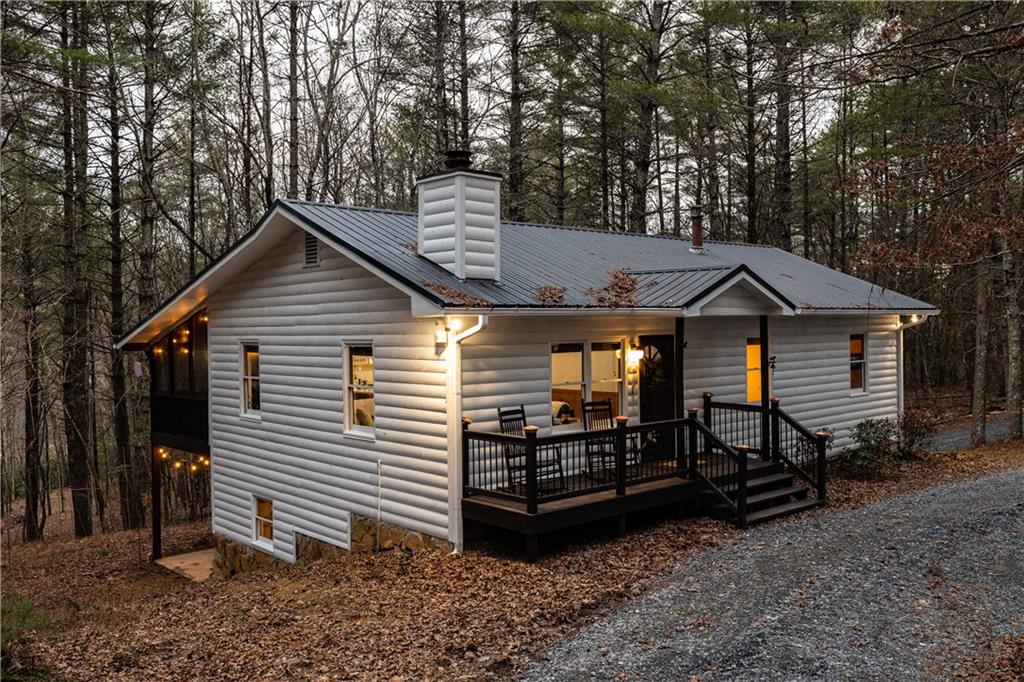 357 Mystic Lane Blue Ridge, GA 30513 - Photo 2 of 58 a view of a house with a yard and roof deck