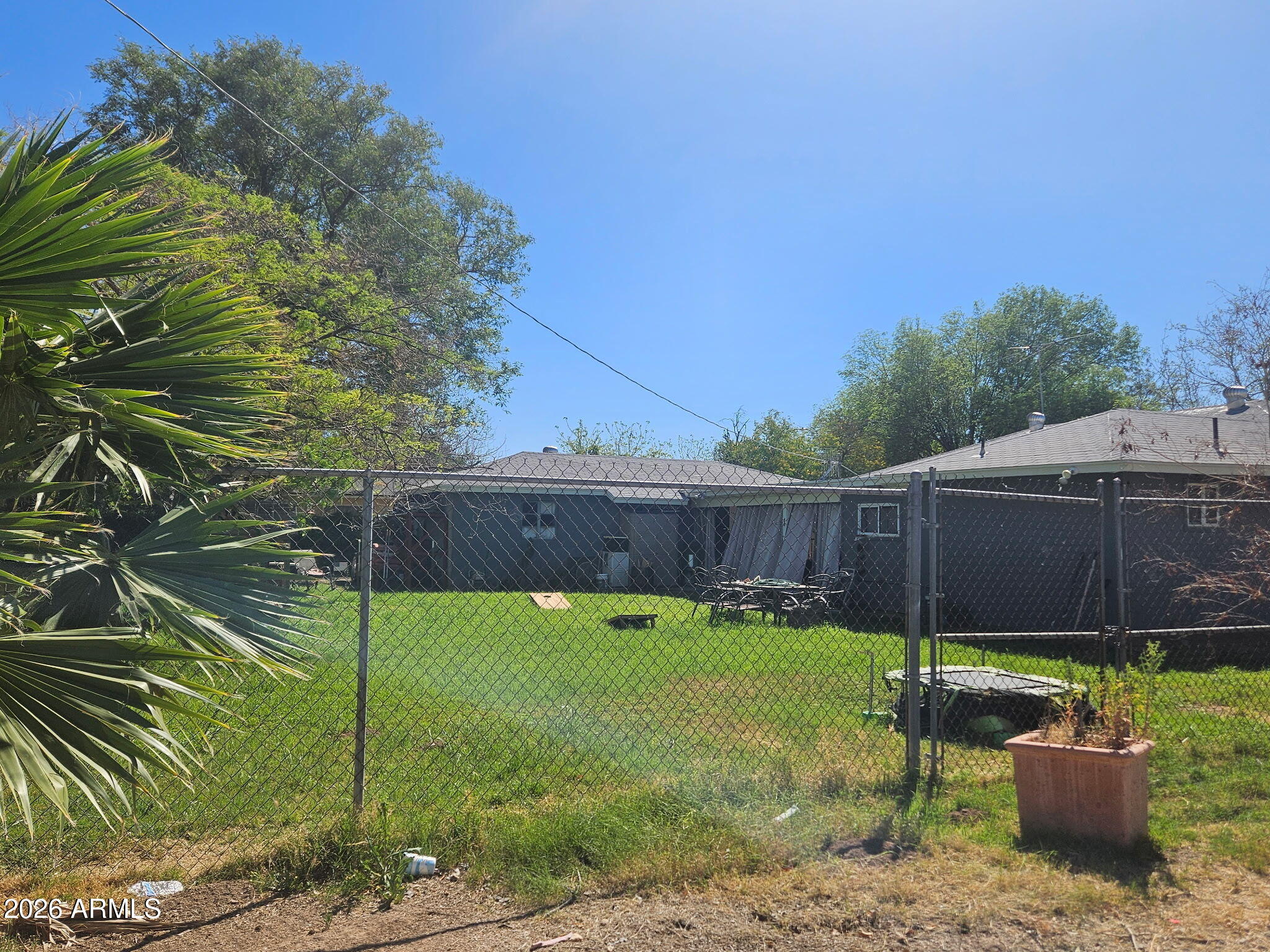 5625 South 9th Street Phoenix, AZ 85040 - Photo 5 of 8 a backyard of a house with a garden