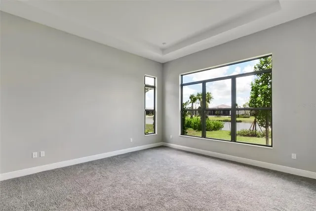 a view of room with window and front door