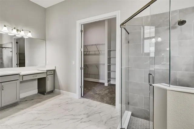 a bathroom with a shower and a sink