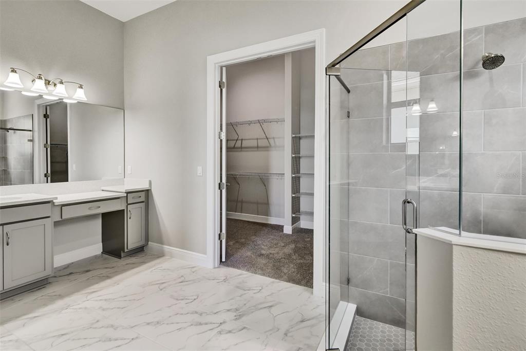4533 Mondrian Court Sarasota, FL 34240 - Photo 22 of 49 a bathroom with a shower and a sink