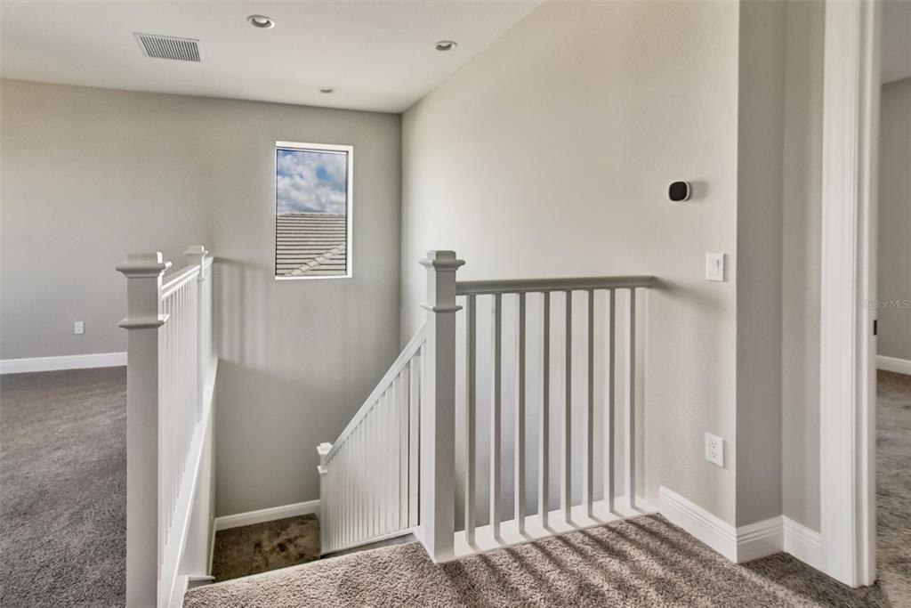 4533 Mondrian Court Sarasota, FL 34240 - Photo 30 of 49 a view of a hallway with windows
