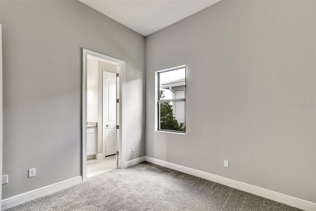 4533 Mondrian Court Sarasota, FL 34240 - Photo 33 of 49 an empty room with windows