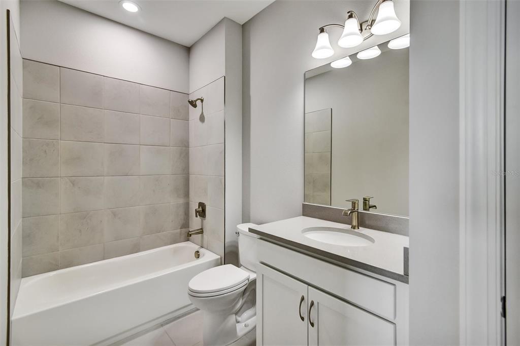 4533 Mondrian Court Sarasota, FL 34240 - Photo 40 of 49 a bathroom with a sink a toilet and bathtub