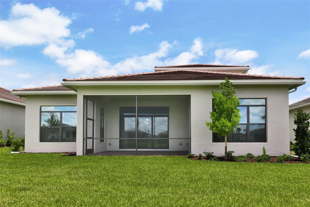 4533 Mondrian Court Sarasota, FL 34240 - Photo 43 of 49 a front view of a house with a garden