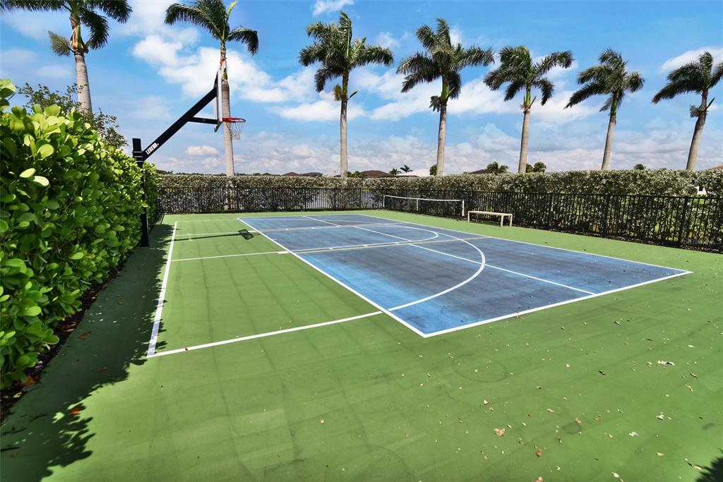 4533 Mondrian Court Sarasota, FL 34240 - Photo 48 of 49 a view of an outdoor space and tennis court
