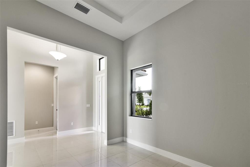 4533 Mondrian Court Sarasota, FL 34240 - Photo 7 of 49 an empty room with windows and closet