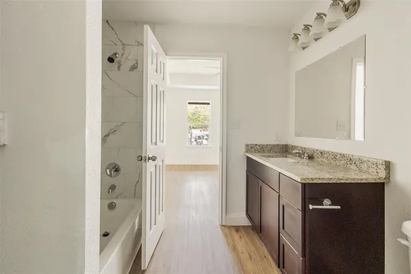 a view of a bathroom with a sink and mirror