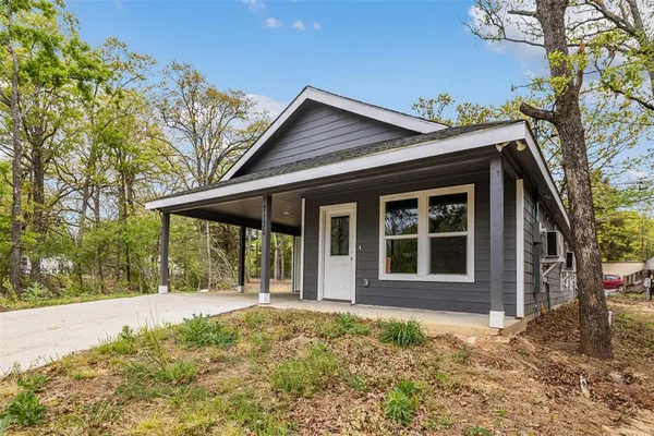 a house with trees in front of it