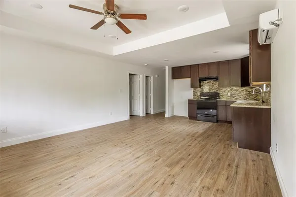 a view of kitchen with cabinets