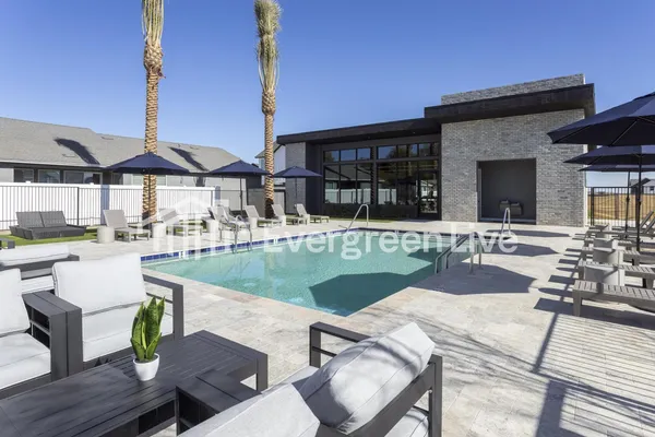 a view of a swimming pool with a terrace