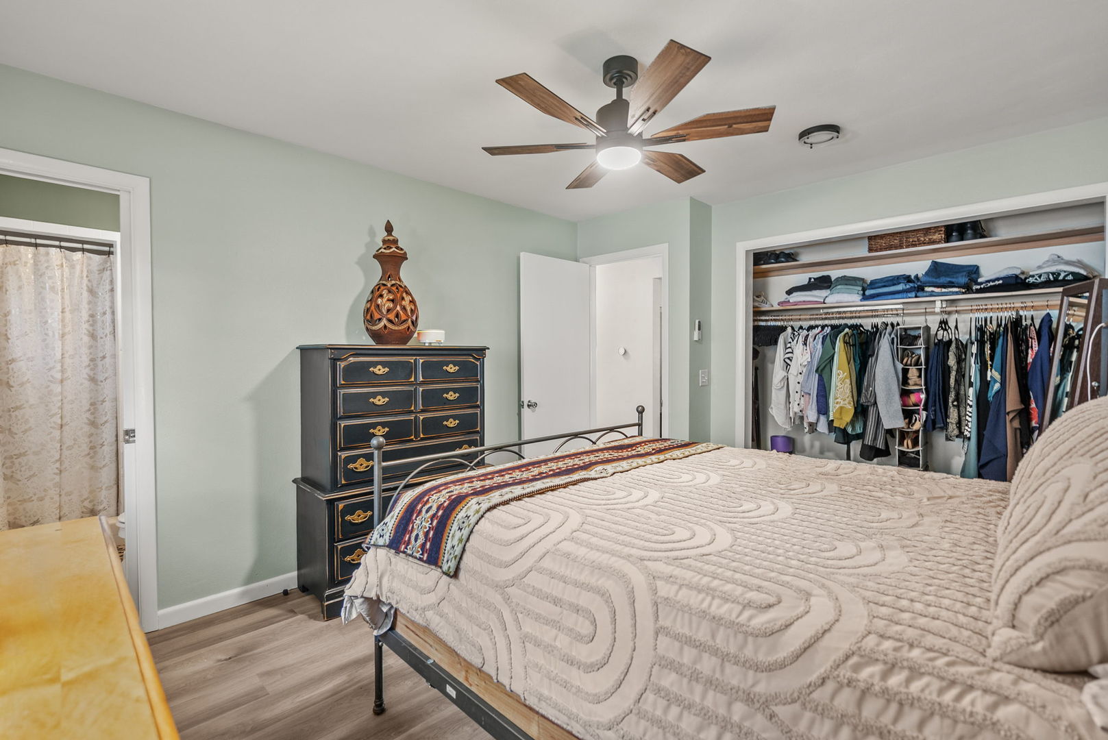 1435 26th Avenue Moline, IL 61265 - Photo 13 of 38 a bedroom with a bed and a chandelier