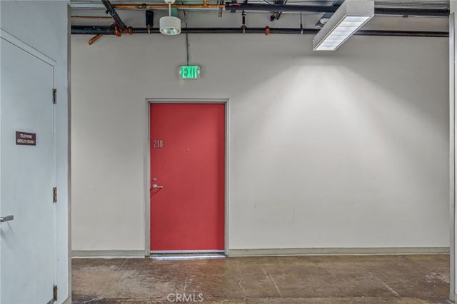 a kitchen with stainless steel appliances granite countertop a sink cabinets a stove and a refrigerator