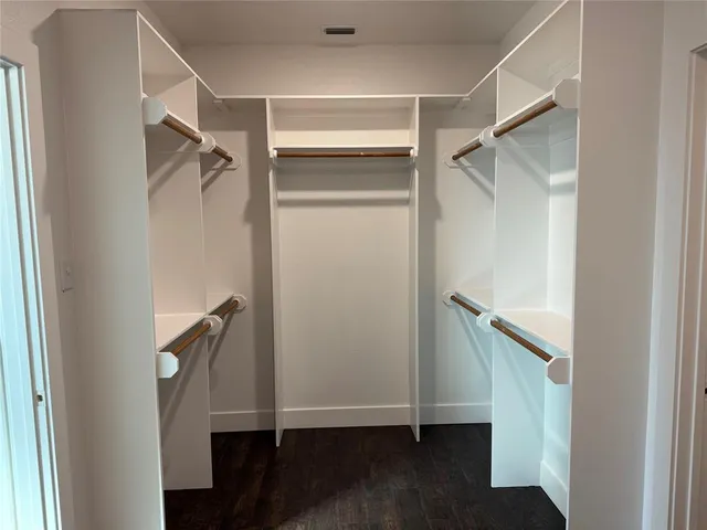a kitchen with stainless steel appliances granite countertop a sink and a refrigerator