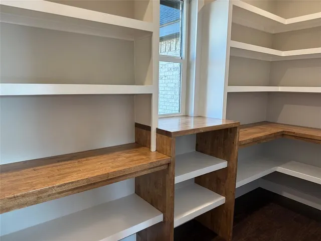 a kitchen with kitchen island a sink and a stove