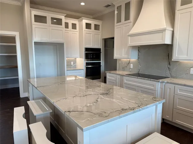 a kitchen with a refrigerator and a sink