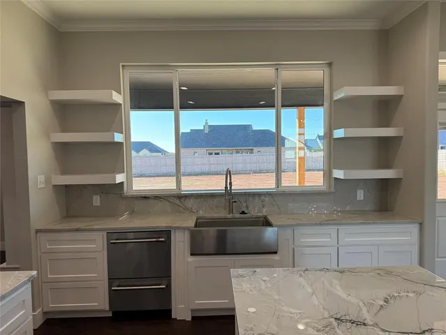 a kitchen with a sink and cabinets