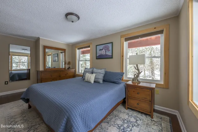 a bedroom with bed and a window